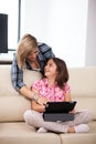 Mother showing her cute teenage daughter something on the tablet PC Royalty Free Stock Photo