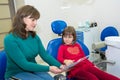 A mother is showing her daughter dental X-rays
