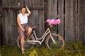 Mother sitting on beige retro bicycle Royalty Free Stock Photo