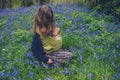 Mother with sleeping baby in meadow Royalty Free Stock Photo