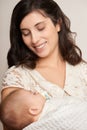 Mother with sleeping baby portrait, happy maternity concept, yellow toned Royalty Free Stock Photo