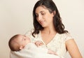 Mother with sleeping baby portrait, happy maternity concept, yellow toned Royalty Free Stock Photo