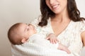 Mother with sleeping baby portrait, happy maternity concept, yellow toned Royalty Free Stock Photo