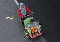 A mother with a small child riding a rickshaw in solo car free d