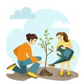 Young mother and small daughter plant tree