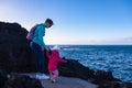 Porto Moniz - Mother and small toddler at natural lava swimming pools Piscinas Naturais Velhas in coastal town Porto Moniz