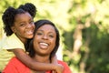 Mother smiling and hugging her daughter