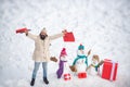 Mother snow-woman, father snow-man and kid wishes merry Christmas and Happy New Year. Happy snow man and bearded man on