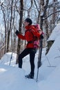 Mother and daughter snowshoeing together