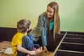 Mother and son assembling furniture. Boy helping his mom at home. Happy Family concept Royalty Free Stock Photo