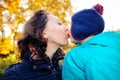 Mother with son in autumn peach garden Royalty Free Stock Photo