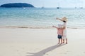 A mother and son on beach outdoors Sea and Blue sky Royalty Free Stock Photo