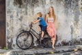 Mother and son on a bicycle. Public street art Name Children on a bicycle painted 3D on the wall that`s two little Royalty Free Stock Photo