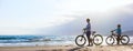 Mother and son biking at beach Royalty Free Stock Photo