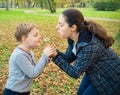 Mother and son blowing dandelion Royalty Free Stock Photo