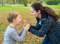 Mother and son blowing dandelion Royalty Free Stock Photo