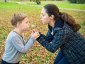 Mother and son blowing dandelion Royalty Free Stock Photo