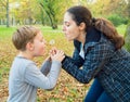 Mother and son blowing dandelion Royalty Free Stock Photo