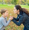 Mother and son blowing dandelion Royalty Free Stock Photo