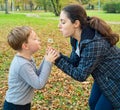 Mother and son blowing dandelion Royalty Free Stock Photo