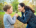 Mother and son blowing dandelion Royalty Free Stock Photo