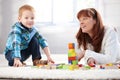 Mother and son building tower together smiling Royalty Free Stock Photo