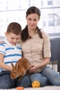 Mother and son with bunny pet Royalty Free Stock Photo