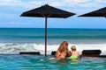 Mother with son chilling in beach swimming pool Royalty Free Stock Photo