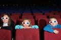 Mother with son and daughter in 3D glasses Royalty Free Stock Photo