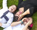 Mother, Son, and Daughter Lauging Outside in the Grass Royalty Free Stock Photo