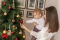 Mother and son decorating Christmas tree Royalty Free Stock Photo