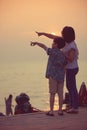Mother and son in a deep moment of love during sunset at beach Royalty Free Stock Photo