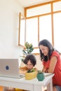 Mother and son do their homework online. distance learning online education. Home education.Schoolboy with laptop and doing Royalty Free Stock Photo