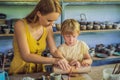 Mother and son doing ceramic pot in pottery workshop Royalty Free Stock Photo