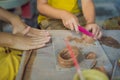 Mother and son doing ceramic pot in pottery workshop. What to do with children. Child friendly place Royalty Free Stock Photo