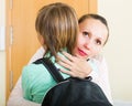 Mother with son at doorway