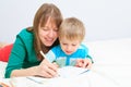 Mother and son drawing present for daddy Royalty Free Stock Photo