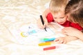 Mother and son drawing present for daddy Royalty Free Stock Photo