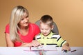 Mother and son drawing together Royalty Free Stock Photo