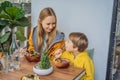 Mother and son eating Raw Organic Poke Bowl with Rice and Veggies close-up on the table. Top view from above horizontal Royalty Free Stock Photo