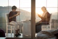 Mother and son enjoying drinking tea on balcony Royalty Free Stock Photo