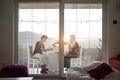 Mother and son enjoying drinking tea on balcony Royalty Free Stock Photo