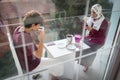 Mother and son enjoying drinking tea on balcony Royalty Free Stock Photo