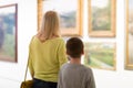 Mother and son exploring paintings Royalty Free Stock Photo