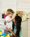 Mother and son with happy faces make blocks constructions Royalty Free Stock Photo