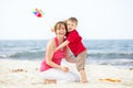 Mother and son having fun on the beach. Royalty Free Stock Photo