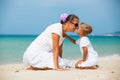 Mother and son having fun on the beach Royalty Free Stock Photo