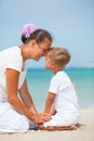 Mother and son having fun on the beach Royalty Free Stock Photo