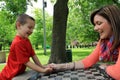 Mother and son having fun thumb wrestling