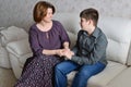 Mother and son hold hands and look at each other Royalty Free Stock Photo